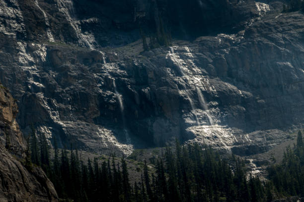 istock Water cascading over Cirrus Mountain Weeping Wall Banff National Park Alberta Canada 1454703304
