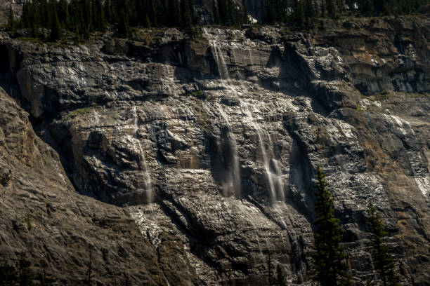 istock Water cascading over Cirrus Mountain Weeping Wall Banff National Park Alberta Canada 1454703432