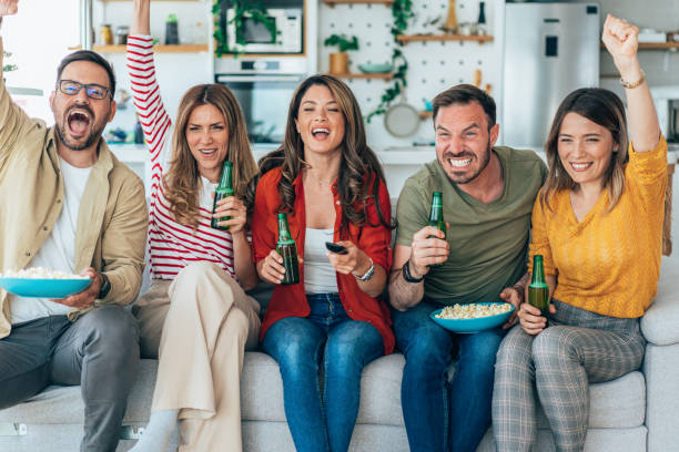 istock Friends watching tv 1454703491