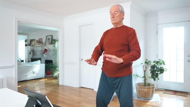 Senior man doing Qi Gong exercises