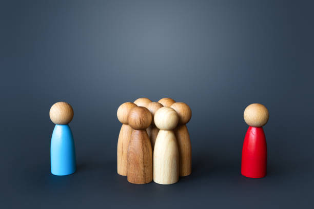 istock Opposing persons bringing people on their side. 1454707447