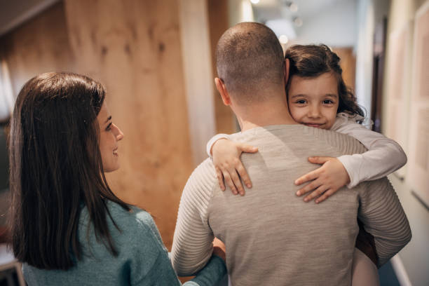 istock Family walking in hotel corridor 1454709595
