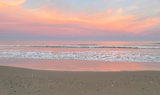Sunset and beautiful pink reflection on the ocean. Corolla Beach, Outer Banks, NC