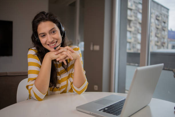 istock Young woman working from home 1454714156