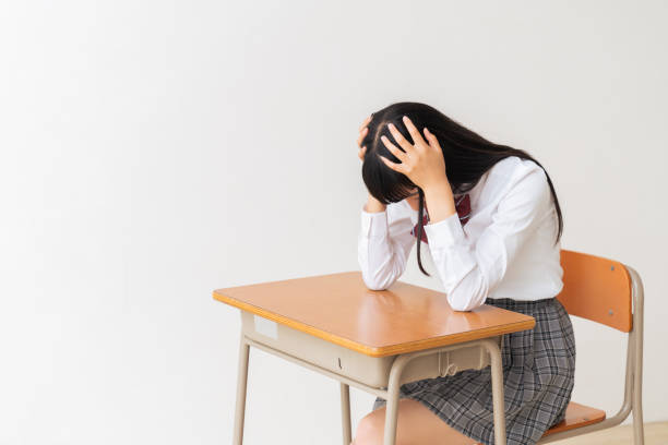 girl who study,think,School uniform,School classroom stock photo