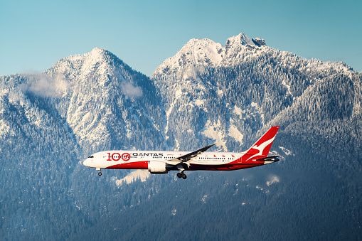 Aerial view of an airport terminal with turbo prop aircraft.