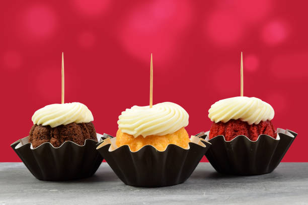 istock Holiday Inspired Gourmet Cupcake Topper Mockup with Red Background 1454723314