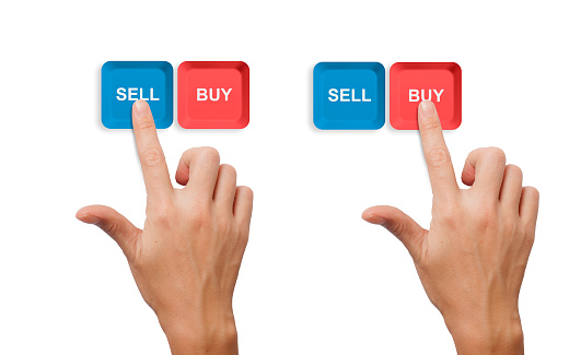 hand choosing buy sell buttons