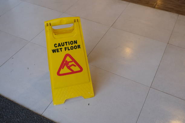 istock Sign showing warning of caution wet floor 1454740620