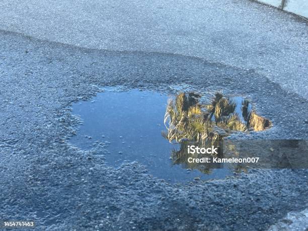 Pothole In Parking Lot Stock Photo - Download Image Now - Puddle, Road, Water