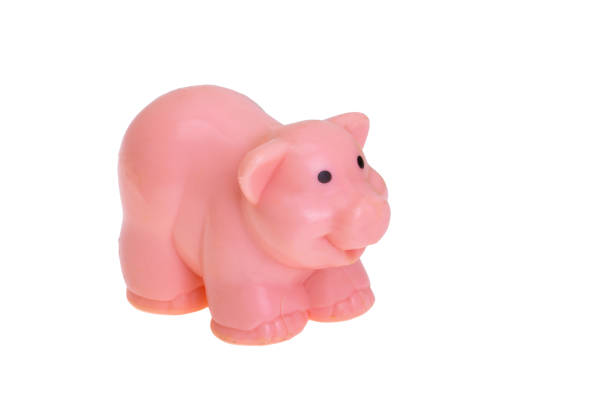 istock figurine of pink pig isolated 1454756767