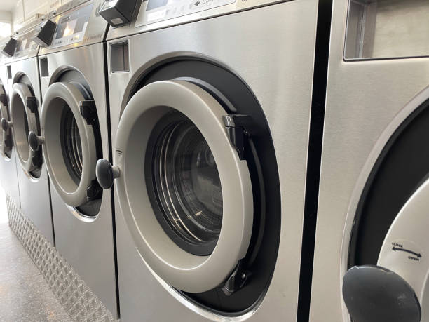 istock Washing clothes at a laundrette 1454762876