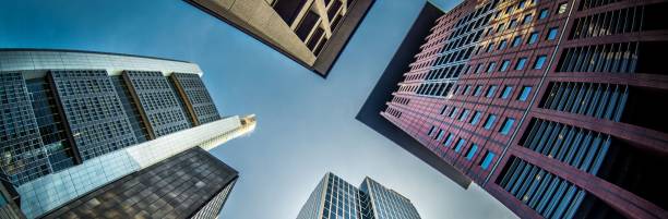 istock Horizontal image of city skyline over blue sky 1454766161