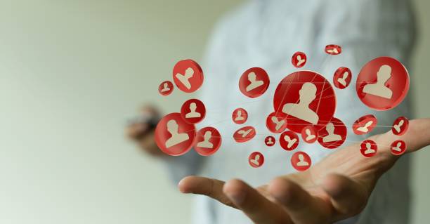 istock Person presenting a virtual projection of people network 1454767965
