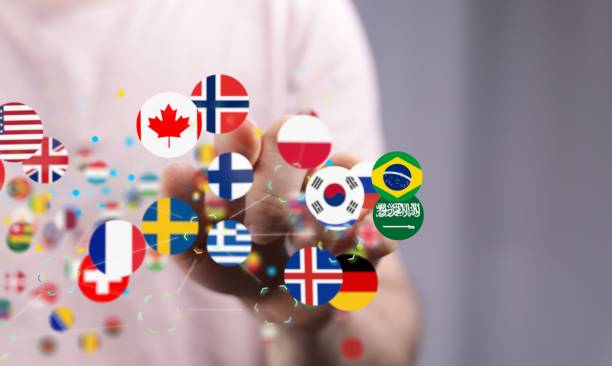 istock 3D render of connected world flags near a hand 1454768019