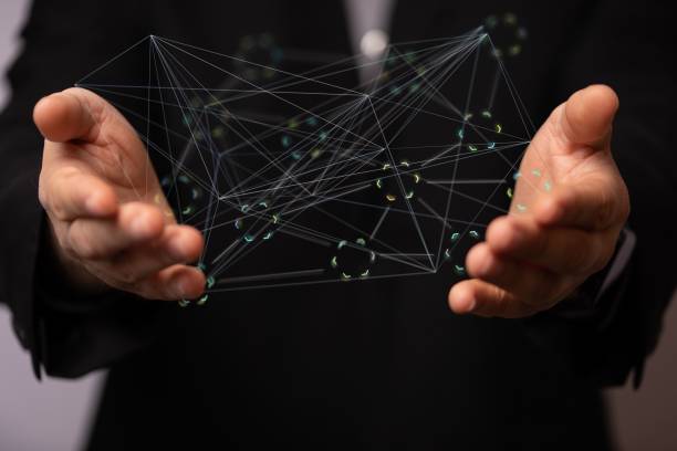istock Businessman holding a floating render of web lines 1454769737