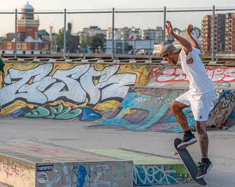 Helsingborg, Sweden – August 08, 2020: A young man doing tricks on his skateboard
