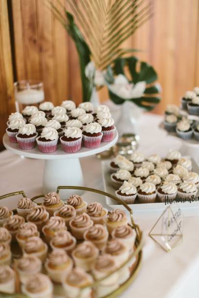 istock Vertical shot of delicious cupcakes on a dessert table 1454771617