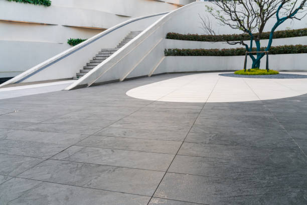 istock Gray empty ground floor in front of modern office building exterior 1454773770