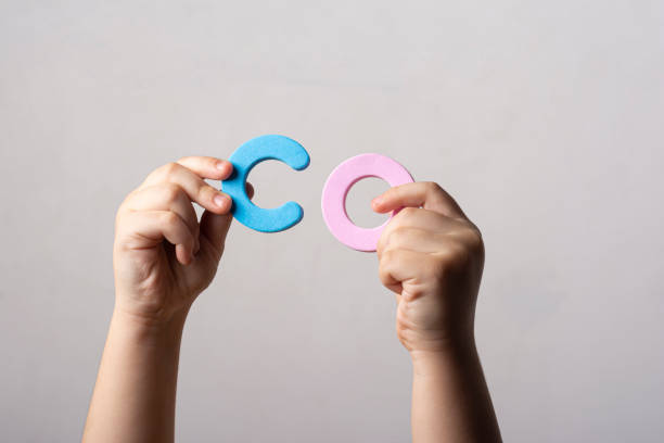 istock View of hands holding two spongy alphabet letters 1454774852