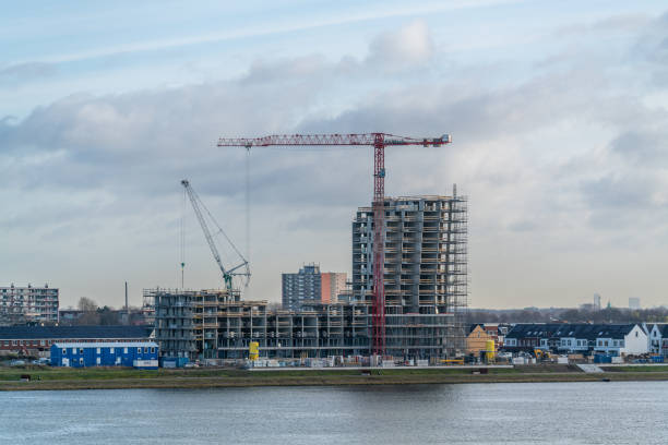 istock Construction site during the day at the edge of a lake 1454777772
