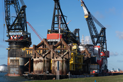 Rotterdam, Netherlands – January 28, 2021: Heerema Marine Contractors' semi-submersible crane vessel Thialf is waiting for maintenance in the port of Rotterdam.