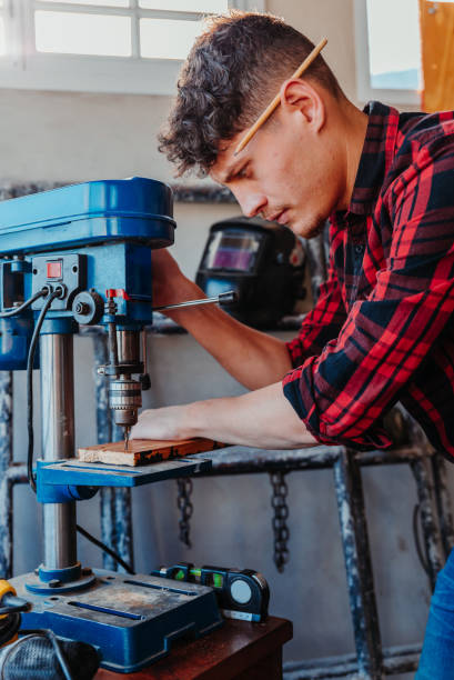 istock Attractive caucasian male carpenter working at the workshop 1454780818