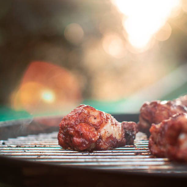 Selective closeup of juicy meat on a grill