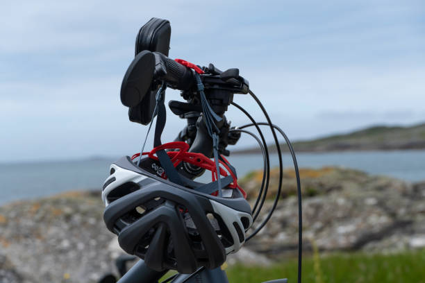 istock Bicycle handlebar and helmet against the cloudy sky 1454781161