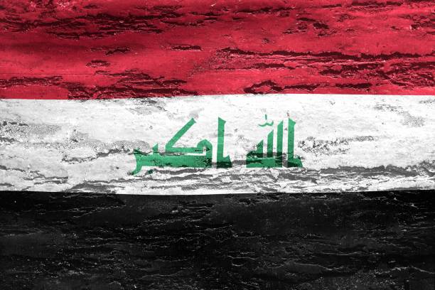 istock Iraq flag printed on a textured chipping wood background 1454782919