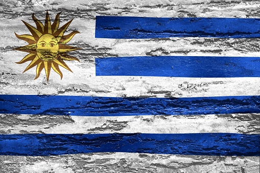 An illustration of the Uruguay flag on a concrete background