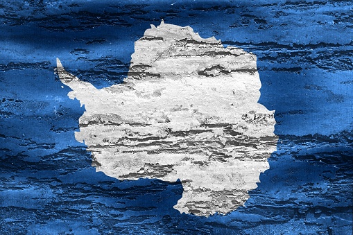 A painted illustration of the Antarctica flag on a wall textured background