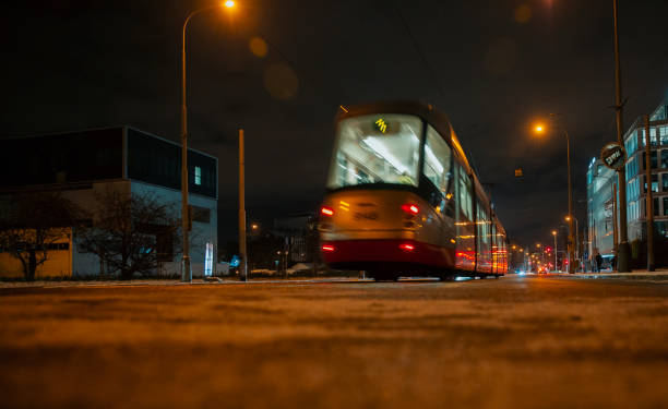 istock Illuminated bus fastly goes forward on the night city street 1454784708