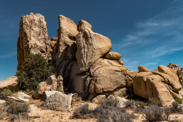 istock Beautiful stark desert landscape with rugged rock formations on a sunny day 1454785639