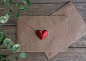 Kraft envelope decorated with a red heart. Preparing for Valentine's Day