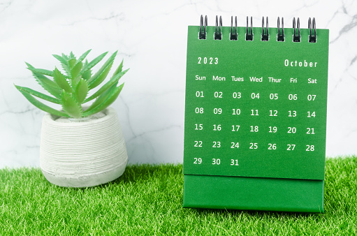 istock The Green October 2023 Monthly desk calendar for 2023 year on grass. 1454789771