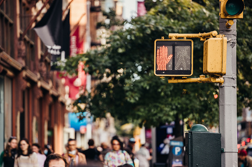 Road Intersection and pedestrian crossing sign in New York lower Manhattan