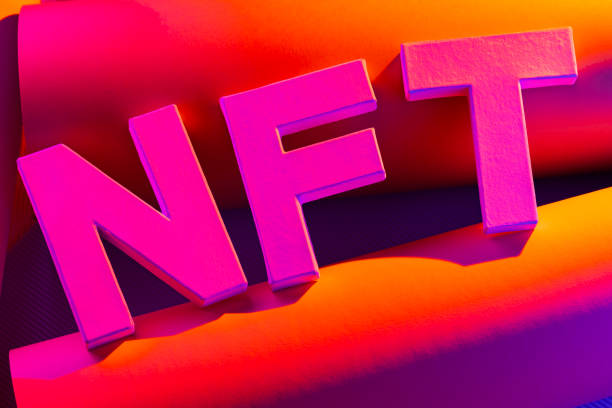 istock NFT (Non-Fungible Token) lettering in colorful neon light. Crypto art concept 1454792135