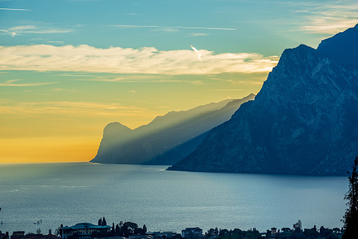 Lake Garda (Lago di Garda) and Italian Alps view from the small village of Nago-Torbole at sunset, Trento province, Trentino Alto Adige, Italy, Europe. On background the coast of Lombardy.