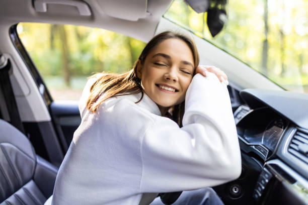 istock Portrait of a beautiful teenage girl smiling while holding the steering wheel. 1454793473