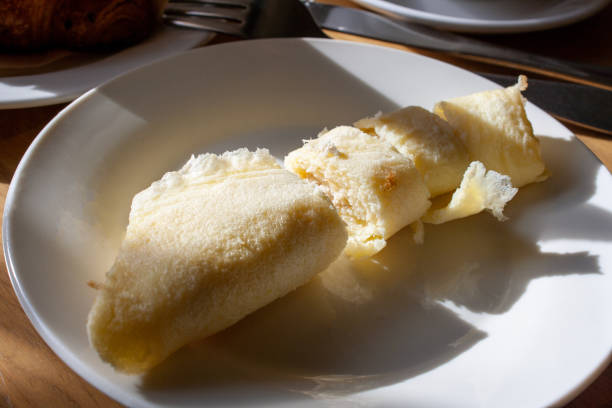 istock egg roll, in the rays of sunlight, lying on a plate with a shadow, selective focus, close-up 1454793614
