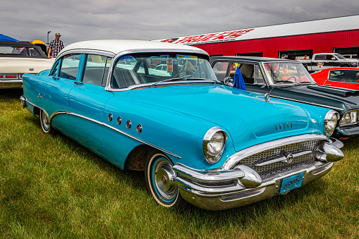 Iola, WI - July 07, 2022: High perspective front corner view of a 1955 Buick Super Series 50 4 Door Sedan at a local car show.