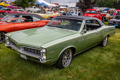 Iola, WI - July 07, 2022: High perspective front corner view of a 1967 Pontiac Tempest LeMans 2 Door Hardtop at a local car show.