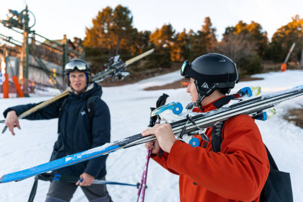istock Two boys walking with ski equipment 1454796740