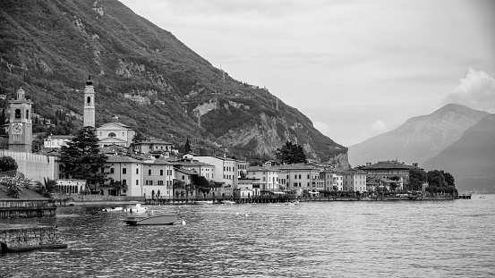 Panoramic black and white view over Gargnano. A historic town on the western shore of lake Garda, Northern Italy.