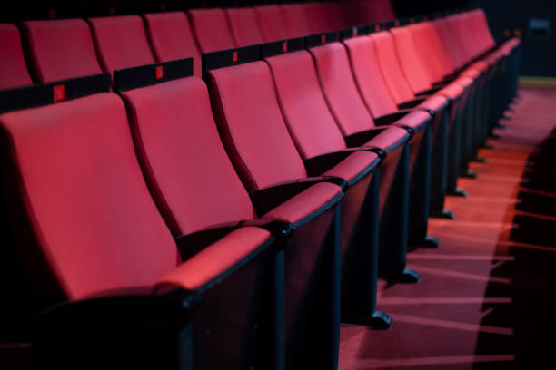 istock vacant theater with red seats 1454799386