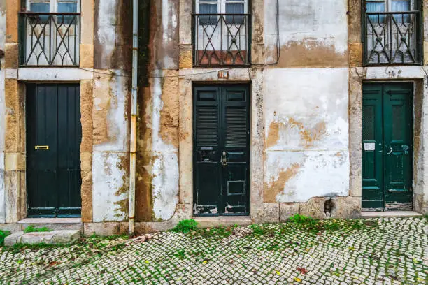 Photo of Old wooden door in the neighbourhood of Alfama in Lisbon, Portugal