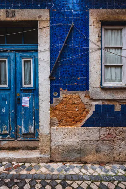 Photo of Old wooden door in the neighbourhood of Alfama in Lisbon, Portugal