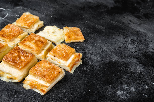 istock Turkish Su Boregi, Tabla borek or burek with cheese. Black background. Top view. Copy space 1454802467