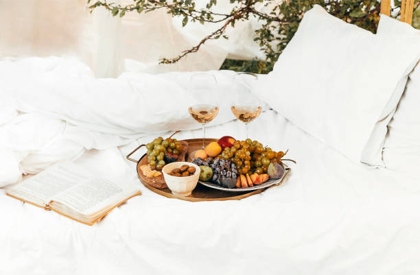 istock Fresh fruits and wine on picnic blanket 1454803775